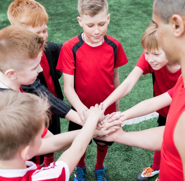 kids-joining-hands-before-match.jpg