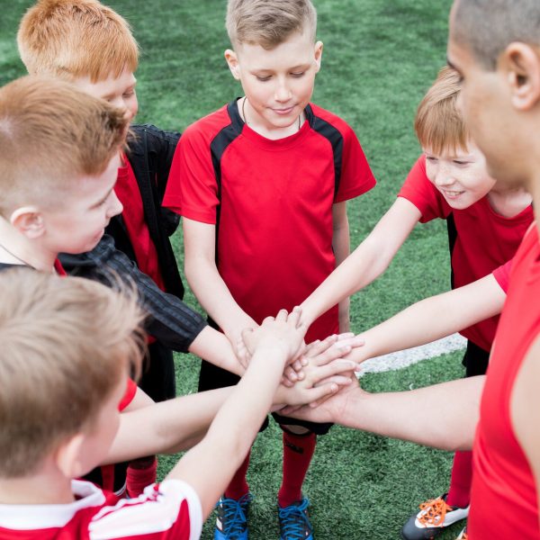 kids-joining-hands-before-match.jpg